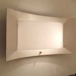 Large black and white lacquered wall light with perspex by Jacques Biny