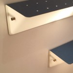 Pair of perforated blue lacquered wall lights with perspex by Jacques Biny
