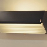 Set of 3 large black lacquered wall lights whith white shutters by Jacques Biny